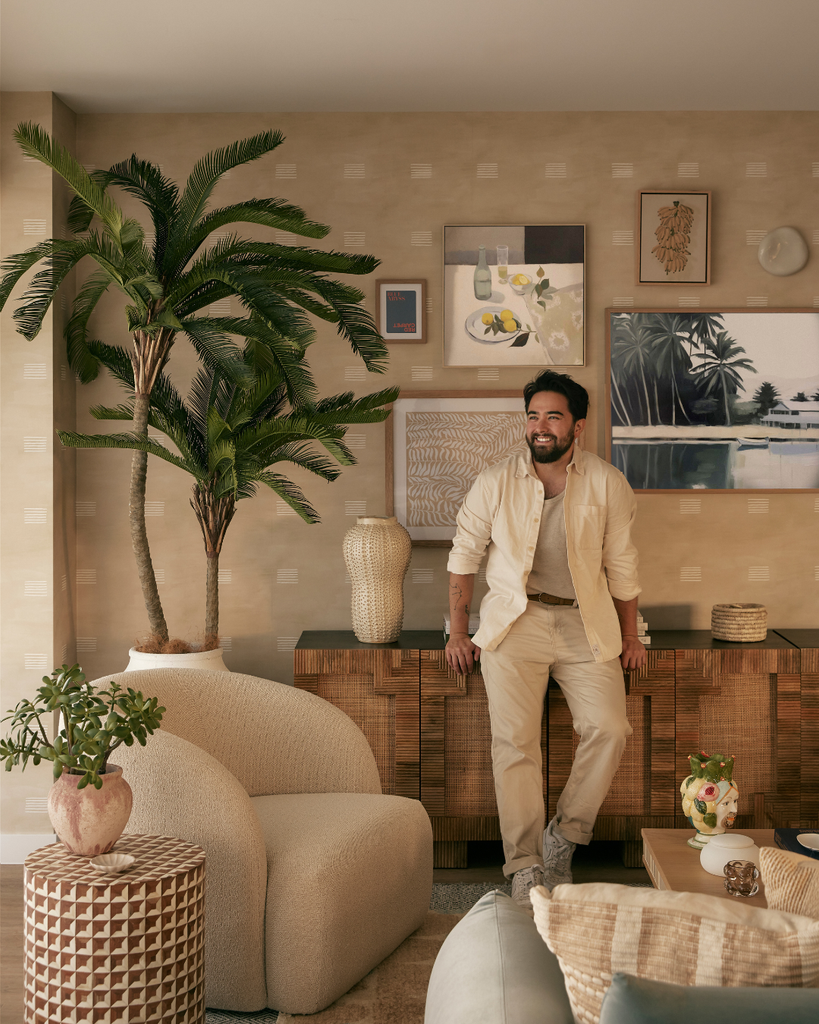 Man standing in a stylish living room with decor elements