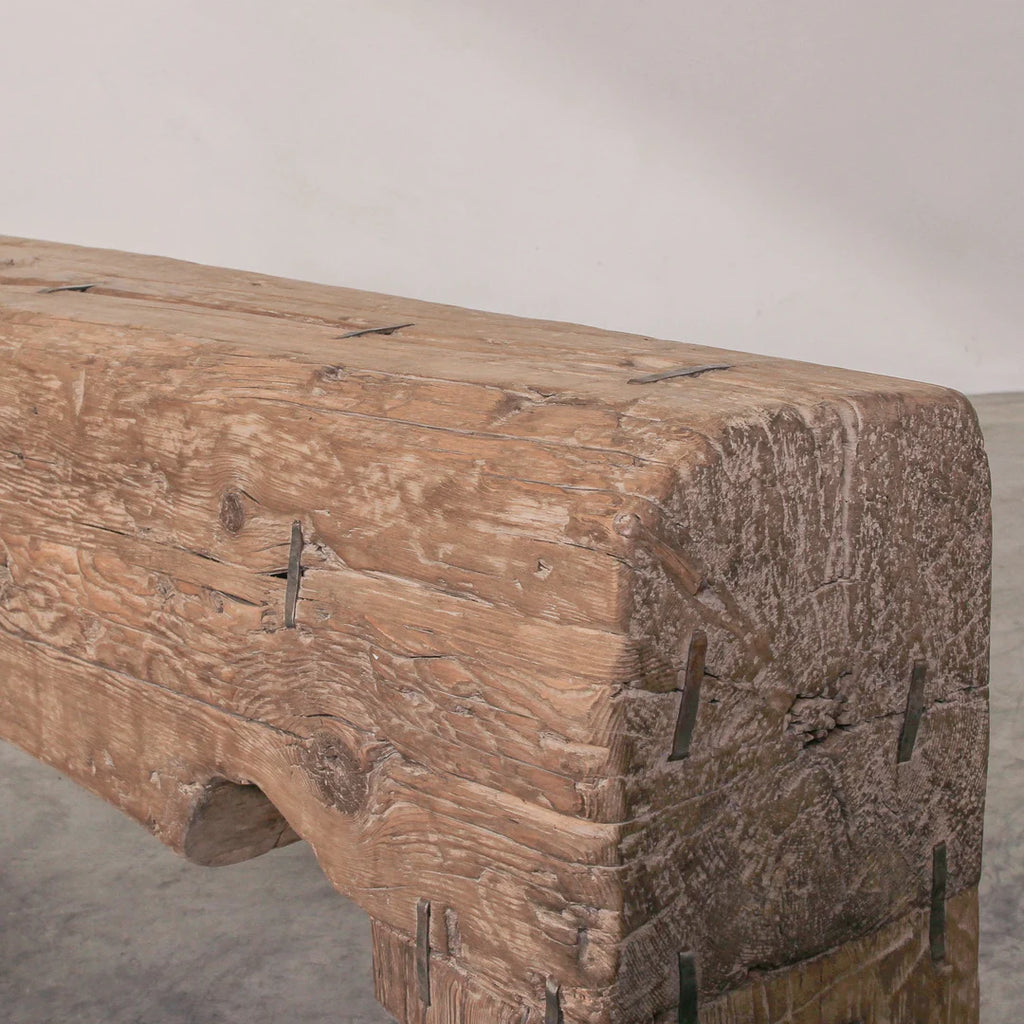 Wooden bench with a rustic design on a plain background