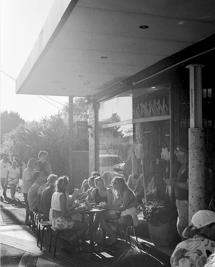 People sitting outside a coffee shop