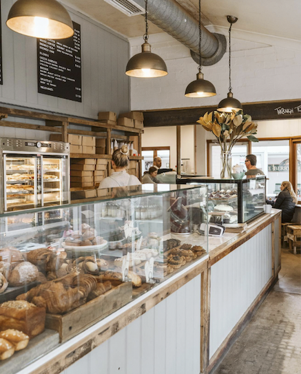 Collage of images including a bakery interior, outdoor seating area, pasta dish, and a cozy cafe.