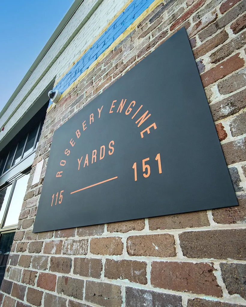 Sign on a brick wall for Rosebery Engine Yards with address 151.
