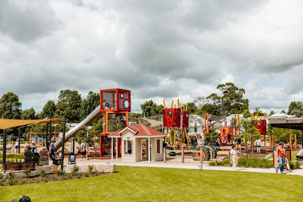 Children's playground with slides and climbing structures on a cloudy day
